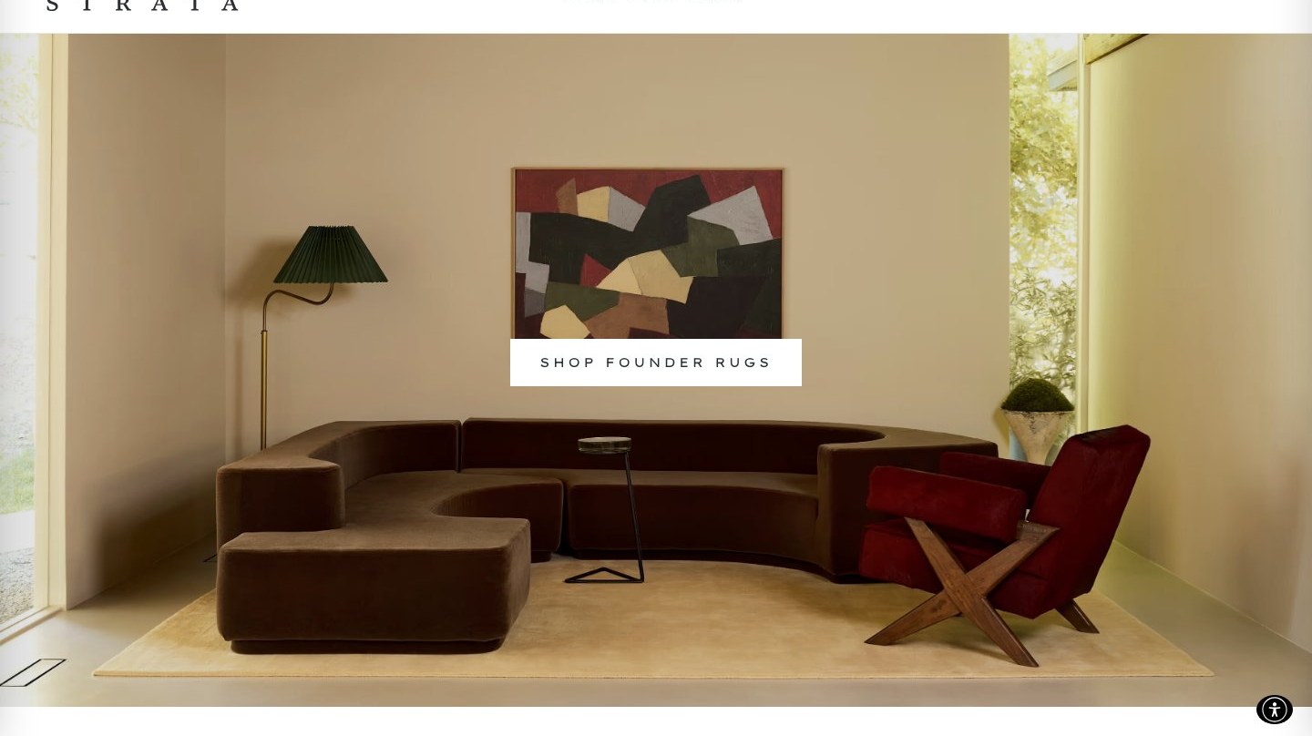 Forma Strata living room with a curved sofa, a red lounge chair and the shop founder rugs banner