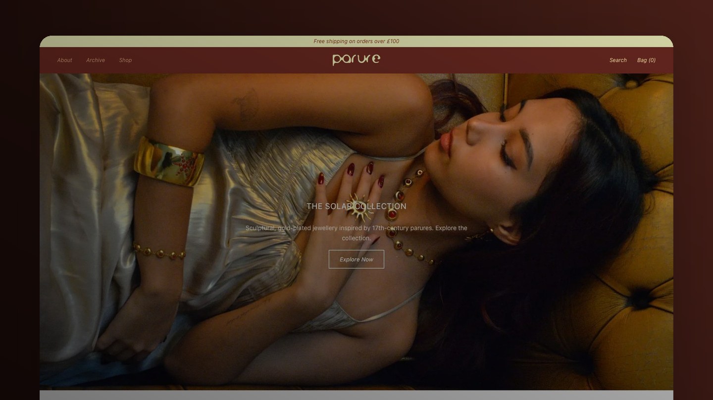 The Parure London storefront, framed on a warm dark backdrop